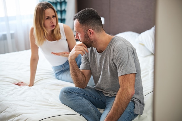 a couple talking privately in their bedroom